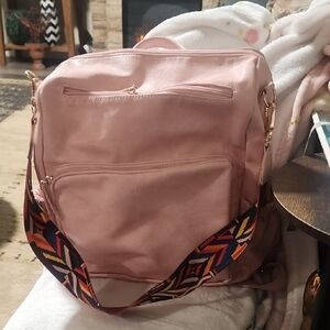 Elegant Pink Backpack with Patterned Strap